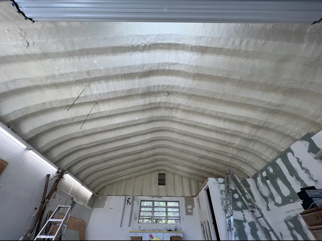 Spray polyurethane foam applied to the underside of a metal roof deck in Lauderdale-by-the-Sea
